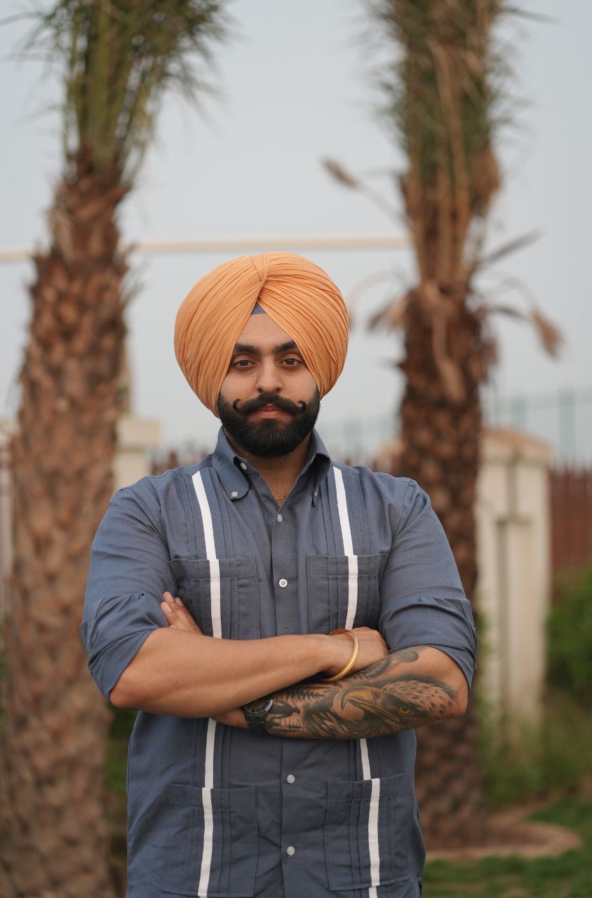 Man wearing a turban with crossed arms designed by luxento