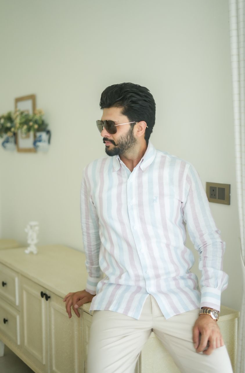 Man wearing a striped shirt by luxento