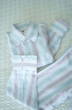 Luxento Pastel striped shirt on a textured white background
