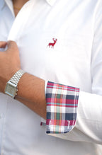 White shirt with plaid cuff and silver watch on wrist